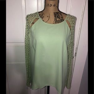 Women’s Light, flowy high-low mint green shirt.